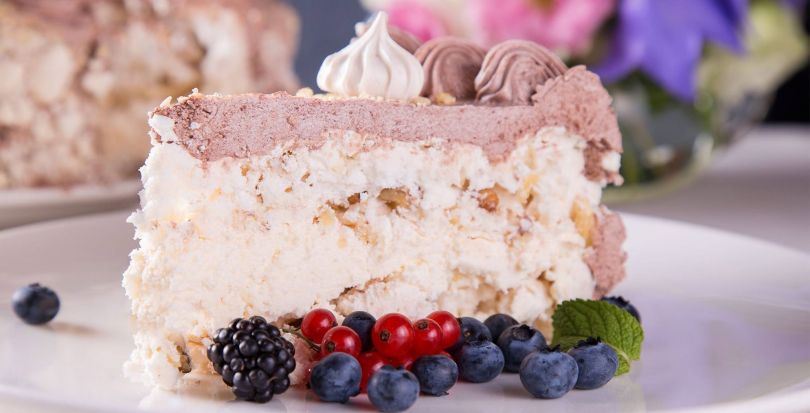 piece of cake with berries on plate