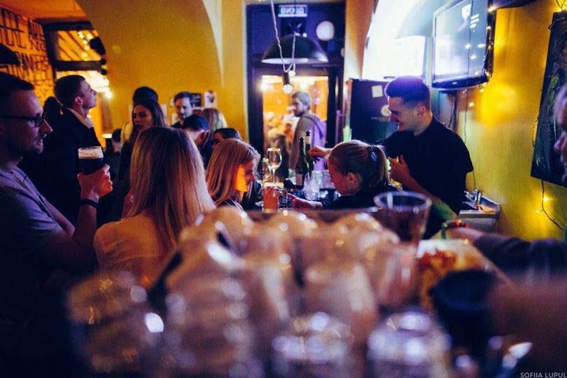 People interacting in a wine bar