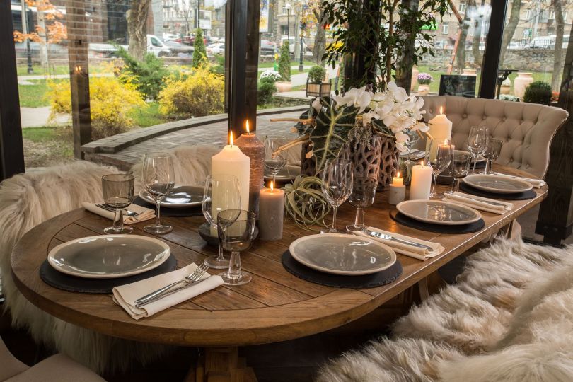 elegant served table with candles and dishes