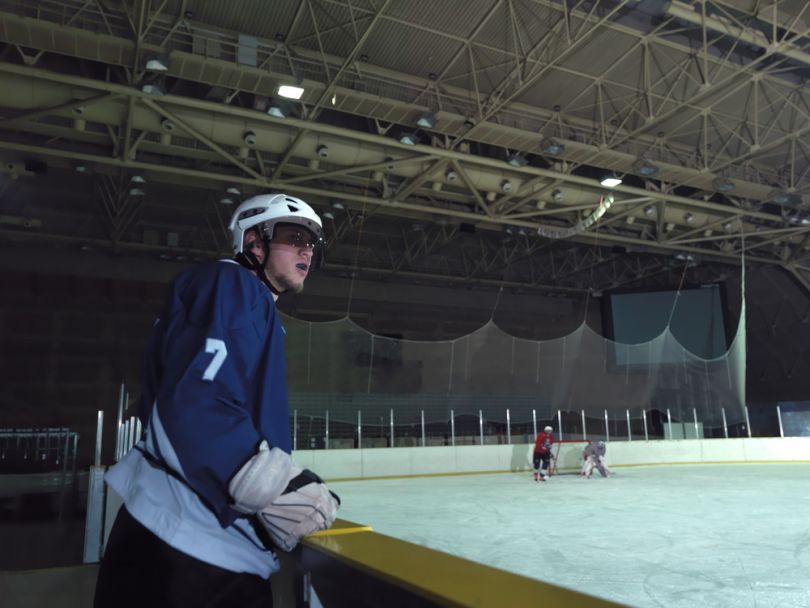 Hockey players near an ice rink