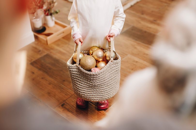 child holding pack of new year toys