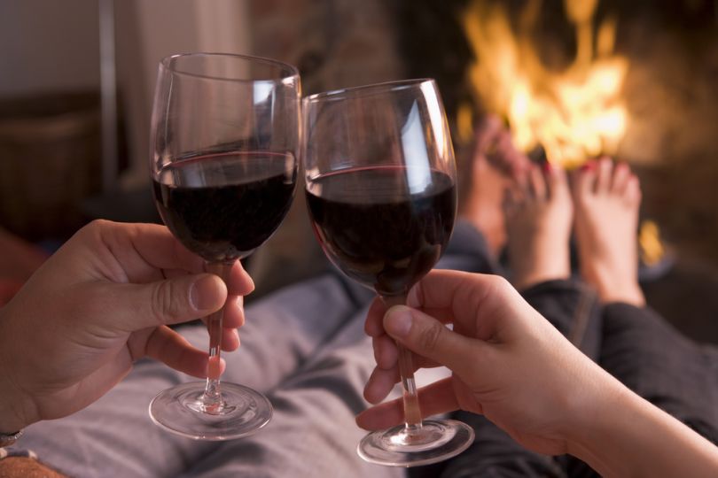 Couple holding glasses of wine