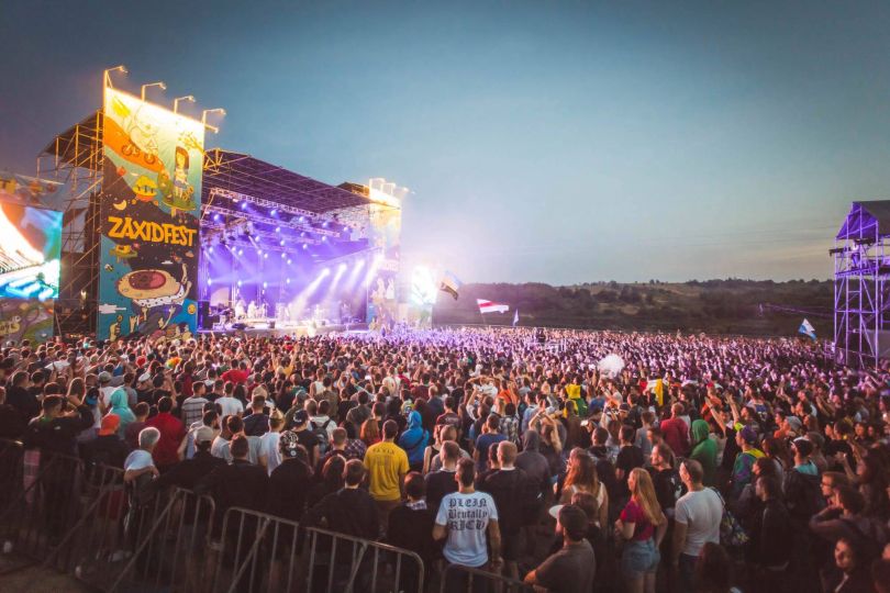 crowd near stage on rock festival