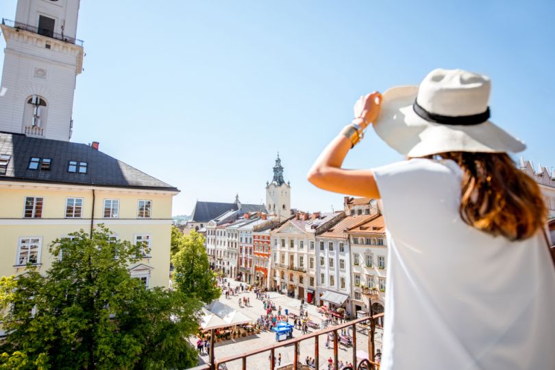 girl standing on the top of lviv town hall