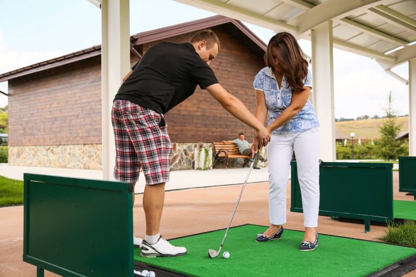 Couple playing golf
