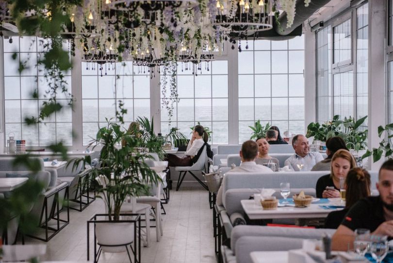 People in restaurant near the Black Sea