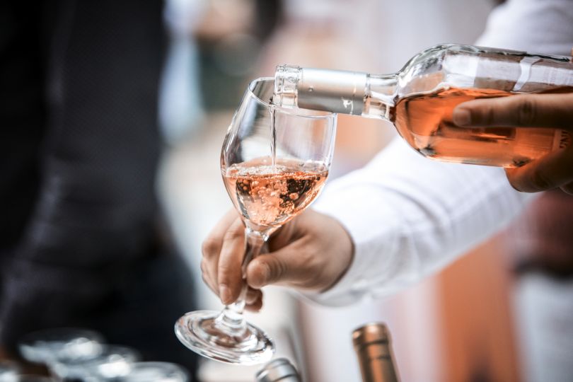 Man pouring rose